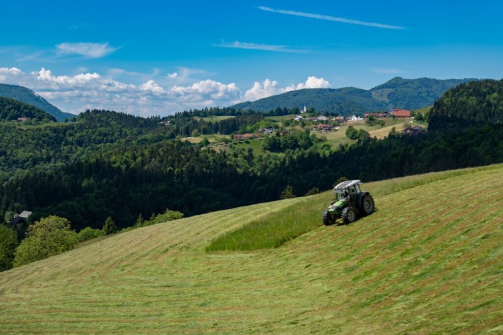 tractor mowing field