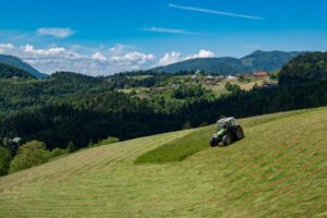 tractor mowing field