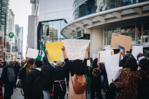 protesters holding signs